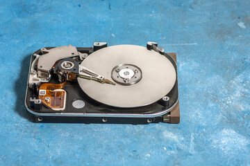 Disassembled hard drive from the computer, hdd with mirror effect. Opened hard drive from the...