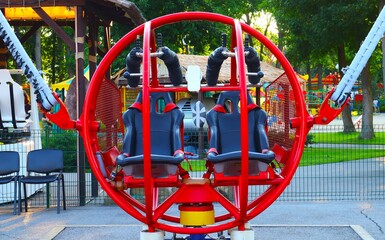 Extreme attraction in the park red round catapult close-up