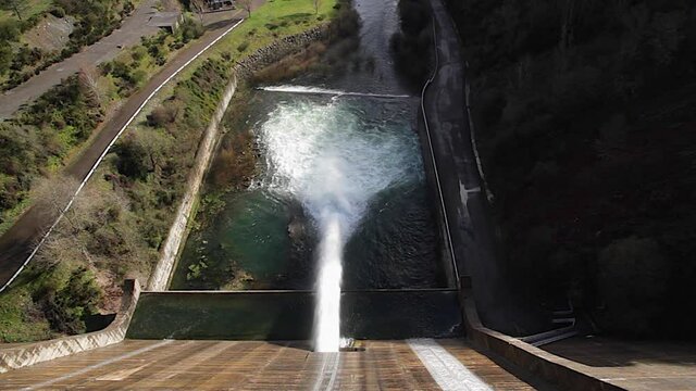 Aerial View of huge gush of water coming at the point of evacuation of a reservoir dam 