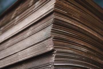 Products and corrugated cardboard. Factory for the manufacture and processing of paper. Copy space, stacks. Selective focus. Capacities and packaging. stock