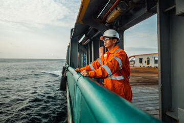 Filipino deck Officer on deck of vessel or ship , wearing PPE personal protective equipment -...