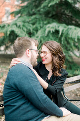 Naklejka premium A couple in love having a romantic moment and showing mutual affection in a local urban park outdoors