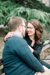 A couple in love having a romantic moment and showing mutual affection in a local urban park outdoors