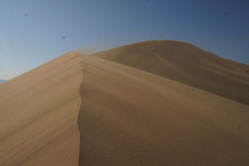 sand dunes and blue skies