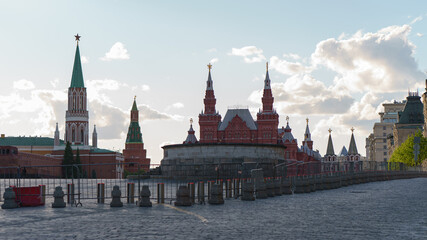 Fototapeta premium Moscow cityscape in spring sunny day. Red Square, Kremlin Towers, State Historical Museum. Bright blue spring sky over the city. Coronavirus pandemic. Quarantine, streets without people. 