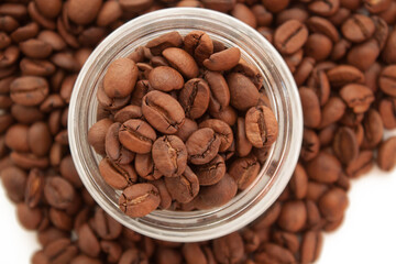 coffe beans in a jar on coffee background