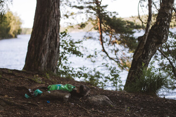 littering at campsite in the forest, plastic garbage left at campsite