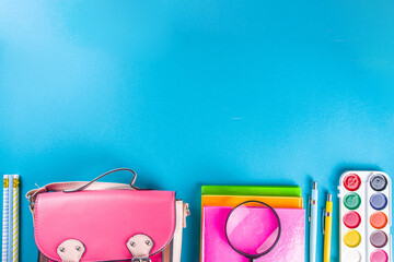 Back to school, education background. Back to School Blue Background with School Bag Backpack, Notebook, Pen, Pencil, Pencils, Magnifying Glass, Eraser, Paper Clip, Alarm Clock, School Supplies