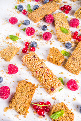 Healthy snack concept,  Cereal granola bars with fresh berries and nuts 