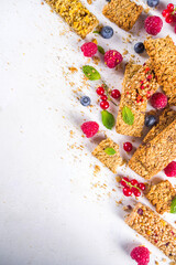 Healthy snack concept,  Cereal granola bars with fresh berries and nuts 