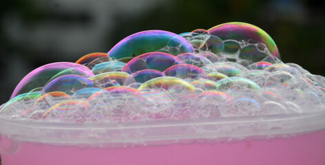 Bubble in water Isolated in black background. Rainbow style