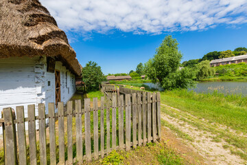 Traditional village in Poland. Open Air Museum. Wooden houses. Wooden folk architecture from different areas of the Lublin Voivodeship. Poland - obrazy, fototapety, plakaty