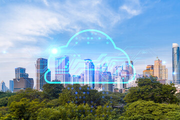 Storage cloud hologram over panorama city view of Bangkok, tech hub in Asia. The concept of...
