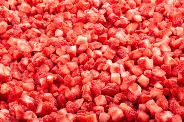 Frozen diced strawberry. Food background. Top view