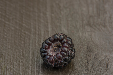 Rubus occidentalis sweet black fruit with color background in hot summer