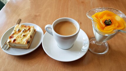 Traditional black coffee and curd cheese cake with raisins for morning breakfast