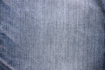 Dark blue jeans denim fabric texture. Classic blue jean clothing, empty denim surface. Seamless casual jeans material, flat lay wallpaper or banner design of classic blue denim backdrop