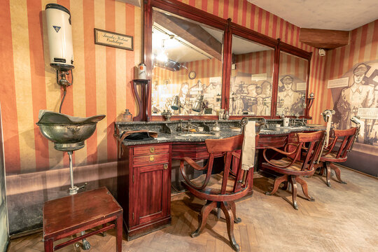 Krakow, Poland - June 3, 2018: Vintage Barber shop furniture used in german-occupied Poland. Inside Oskar Schindler's Enamel factory museum