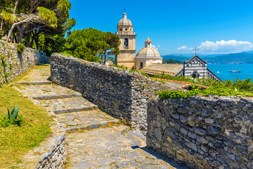 A view from the grounds of Doria Castle towards the Church of San Lorenzo in Porto Venere, Italy in...