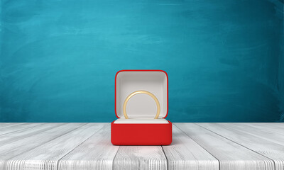 3d rendering of open red box with gold ring lying in it, on wooden table near blue wall.