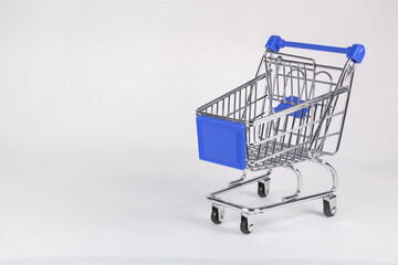 Shopping cart with blue elements on a white background.