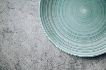 green plate on marble background
