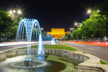 Fototapeta premium The Palace of the Parliament in Bucharest, Romania, by night. The second largest administrative building in the World. View from Unirii Boulevard.