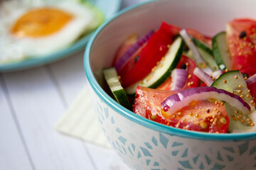tomatoes and cucumbers salad with red onion