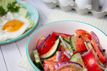 tomatoes and cucumbers salad with red onion