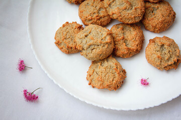 homemade peanut cookies with pink flowers on the white background