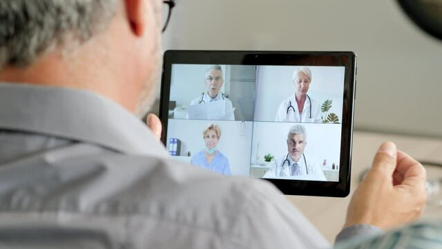 Social distancing medical conference,group of doctors in self isolation talking discussing on video chat livestreaming,greeting with elbow bump,work team remote working online using zoom app