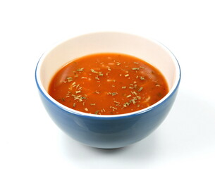 Bowl of tomato soup isolated on a white background