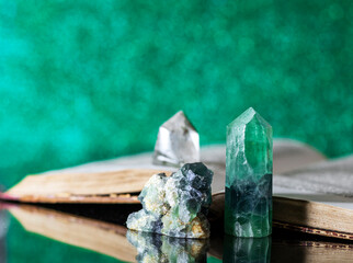 Old book and mineral stones crystals. Crystal Ritual, Healing Crystals. Natural gemstones. Gemstones are full of healing energy and good vibes.