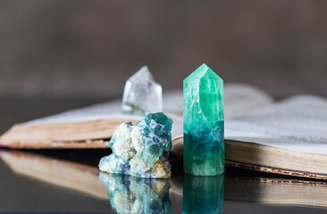 Old book and mineral stones crystals. Crystal Ritual, Healing Crystals. Natural gemstones....