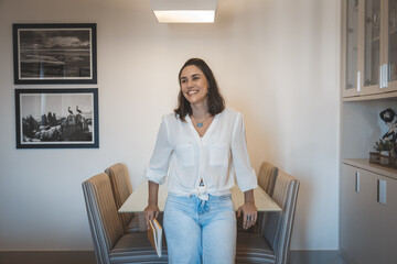 young brazilian woman smiling and relaxing at home