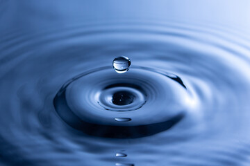 Drop of water is separated from the water from above, the water flows from top to bottom