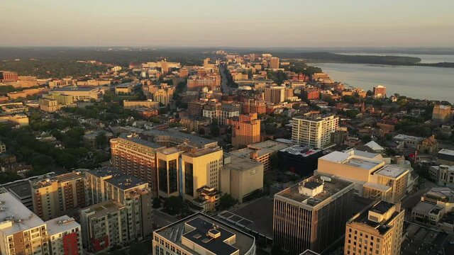Aerial view of City of Madison. The capital city of Wisconsin from above. Drone flying over downtown. Sunny morning, sunrise (sunset), sunlight, summertime