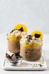 Ginger chocolate overnight oats in glasses.  Selective focus, copy space.