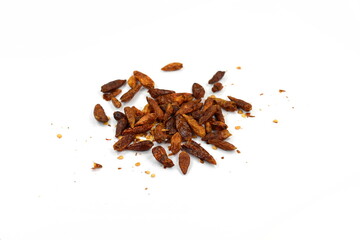Dried red hot chilli pepper isolated on white background. Cayenne pepper. Pile crushed red cayenne pepper, dried chili flakes and seeds isolated on white background.
