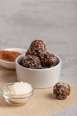 Raw food balls in a bowl with carob