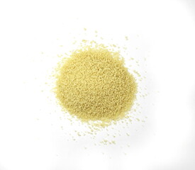 Fototapeta na wymiar Dry couscous isolated on white. Spilled couscous.