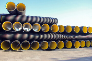 Corrugated pipes. This pipe used for many years in the leading European countries the US and Japan; having a high compressive strength and are serrated outer tube having rounded appearance. - obrazy, fototapety, plakaty