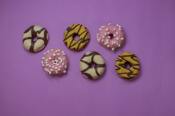 Colored donuts with chocolate shavings