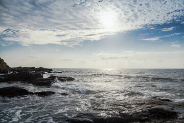 Rocky seashore under under the cloudy sky