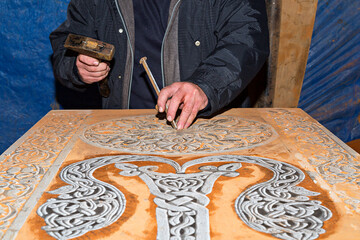 Making traditional Armenian tombstones known as Khachkars.