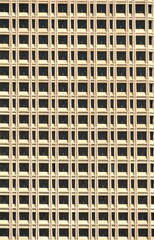 Pattern formed by the windows of a large office building