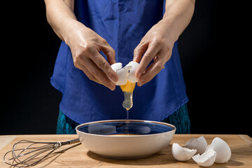 Egg yolk comes out of the shell.