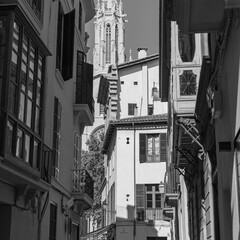 view from the narrow old street of the gothic cathedral in the Spanish city of Palma de Mallorca