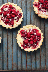 Baked mini tarts with raspberries