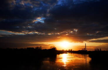 Fototapeta na wymiar Sunset light over Mures river, Arad, Romania
